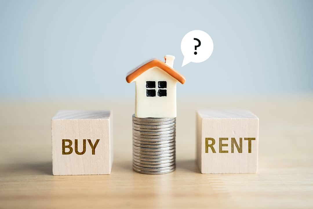 A conceptual photo of choosing between renting or buying a home.